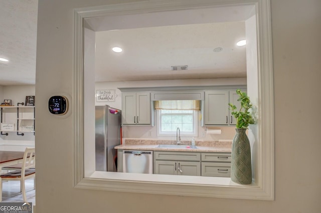 527 Malcom Rd, Covington, GA 30014 - kitchen with a sink, appliances with stainless steel finishes, light countertops, and recessed lighting