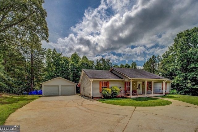 527 Malcom Rd, Covington, GA 30014 - ranch-style home with covered porch, an outdoor structure, a garage, and a front lawn