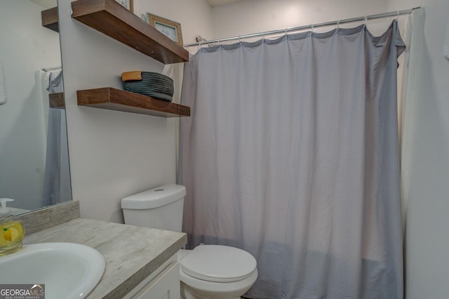 527 Malcom Rd, Covington, GA 30014 - bathroom with vanity, toilet, and a shower with shower curtain