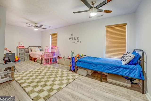 527 Malcom Rd, Covington, GA 30014 - bedroom with wood finished floors and a ceiling fan