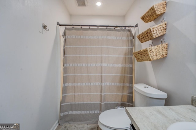527 Malcom Rd, Covington, GA 30014 - full bathroom featuring toilet, a shower with shower curtain, and vanity