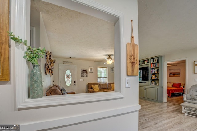 527 Malcom Rd, Covington, GA 30014 - kitchen featuring a textured ceiling, wood finished floors, a ceiling fan, and open floor plan
