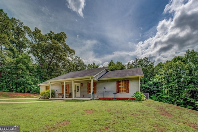 527 Malcom Rd, Covington, GA 30014 - ranch-style house featuring a front yard and covered porch