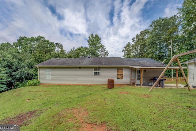 527 Malcom Rd, Covington, GA 30014 - back of property with a yard and a patio