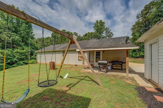 527 Malcom Rd, Covington, GA 30014 - back of house featuring a patio and a lawn