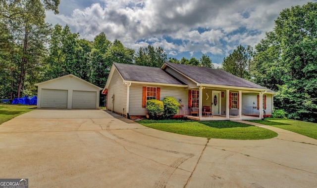 527 Malcom Rd, Covington, GA 30014 - ranch-style home featuring covered porch, a garage, an outbuilding, and a front yard