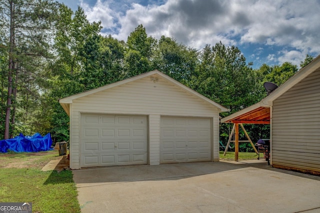 527 Malcom Rd, Covington, GA 30014 - detached garage with view of scattered trees