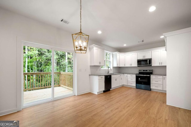 4095 Oriole Ln, Fairburn, GA 30213 - kitchen featuring stainless steel microwave, range with electric stovetop, dishwasher, recessed lighting, and white cabinetry