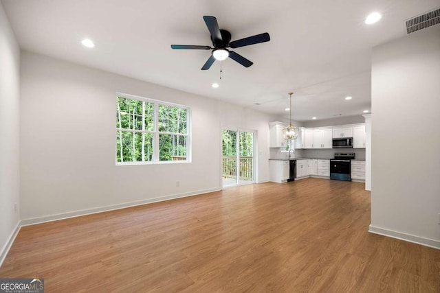 4095 Oriole Ln, Fairburn, GA 30213 - unfurnished living room featuring recessed lighting, a ceiling fan, and light wood-style floors