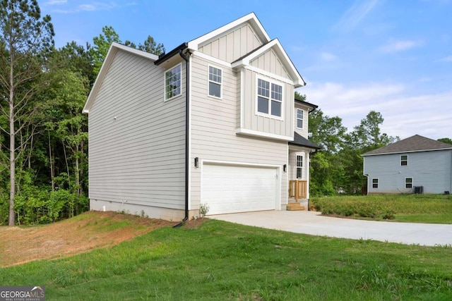 4095 Oriole Ln, Fairburn, GA 30213 - craftsman-style home with board and batten siding, an attached garage, a front yard, and driveway