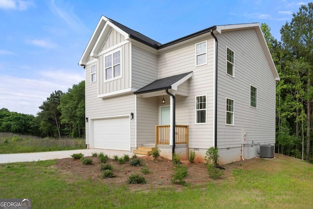 4095 Oriole Ln, Fairburn, GA 30213 - view of front of property with a garage, concrete driveway, crawl space, a front lawn, and board and batten siding