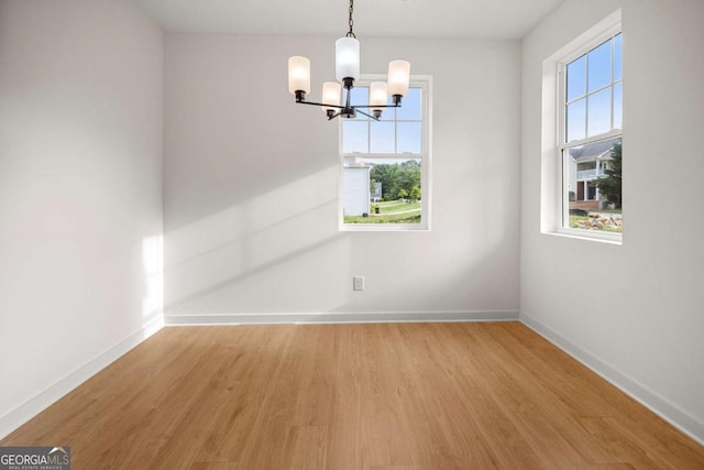 4095 Oriole Ln, Fairburn, GA 30213 - empty room featuring a chandelier and light wood-type flooring