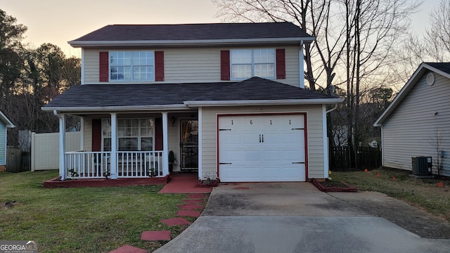 1611 Cobbs Creek Ln, Decatur, GA 30032 - traditional-style home with covered porch, central AC unit, a front yard, concrete driveway, and a garage