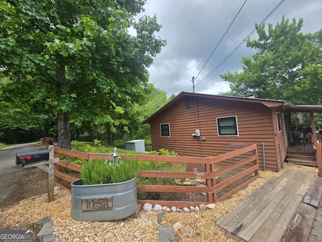 1151 Twin Mountain Lakes Cir, Talking Rock, GA 30175 - view of side of home featuring a deck and an outbuilding