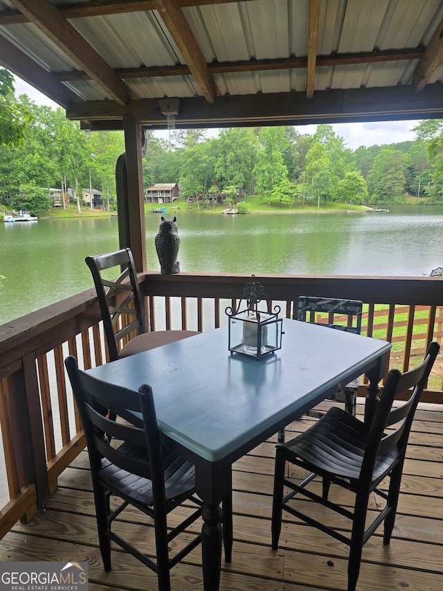 1151 Twin Mountain Lakes Cir, Talking Rock, GA 30175 - wooden terrace featuring a water view, outdoor dining area, and view of wooded area
