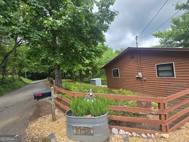 1151 Twin Mountain Lakes Cir, Talking Rock, GA 30175 - view of side of home featuring a shed