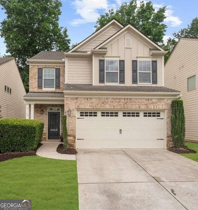 3607 Archgate Ct, Alpharetta, GA 30004 - view of front of property with a garage, driveway, a front yard, brick siding, and board and batten siding