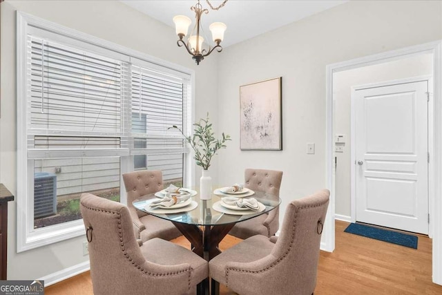 3607 Archgate Ct, Alpharetta, GA 30004 - dining area with light wood-style floors and a chandelier