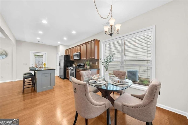 3607 Archgate Ct, Alpharetta, GA 30004 - dining area featuring a chandelier, light wood-style flooring, and recessed lighting