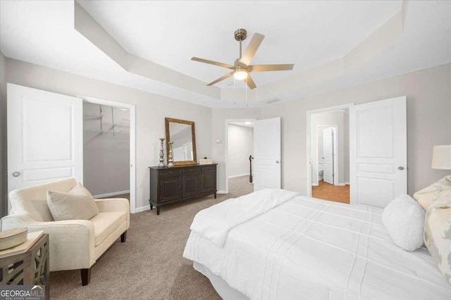 3607 Archgate Ct, Alpharetta, GA 30004 - bedroom featuring a raised ceiling, a spacious closet, light colored carpet, a closet, and a ceiling fan