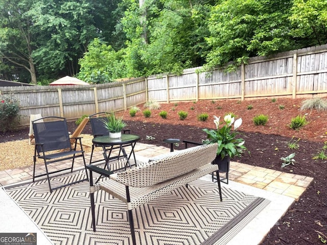 3607 Archgate Ct, Alpharetta, GA 30004 - fenced backyard with a patio area
