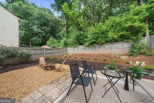 3607 Archgate Ct, Alpharetta, GA 30004 - fenced backyard featuring a patio area and an outdoor fire pit