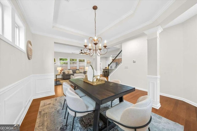 3607 Archgate Ct, Alpharetta, GA 30004 - dining area with a chandelier, wood finished floors, stairway, ornate columns, and crown molding