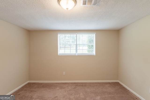 4669 Birch Ridge Trl, Stone Mountain, GA 30083 - carpeted spare room with baseboards and a textured ceiling