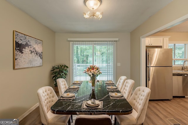 4669 Birch Ridge Trl, Stone Mountain, GA 30083 - dining space with light wood-style floors and baseboards
