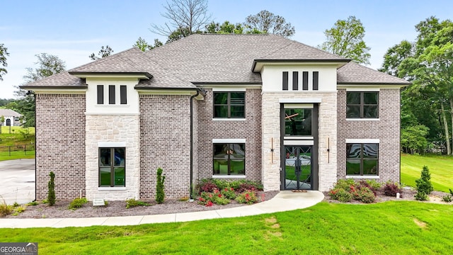 3012 Flat Shoals Rd SW, Conyers, GA 30094 - view of front of house featuring a front yard, stone siding, a shingled roof, and french doors