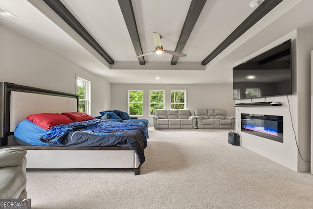 3012 Flat Shoals Rd SW, Conyers, GA 30094 - carpeted bedroom featuring a glass covered fireplace, a raised ceiling, a ceiling fan, and recessed lighting