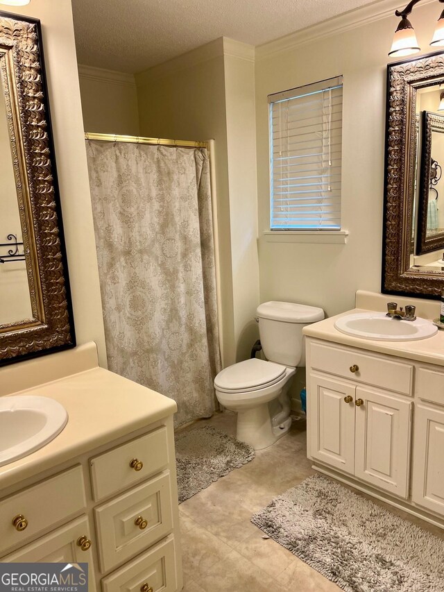 507 S College St, Metter, GA 30439 - bathroom with vanity, toilet, crown molding, a textured ceiling, and tile patterned flooring