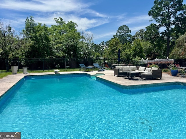 507 S College St, Metter, GA 30439 - view of swimming pool featuring an outdoor hangout area, a fenced backyard, a patio area, and view of wooded area