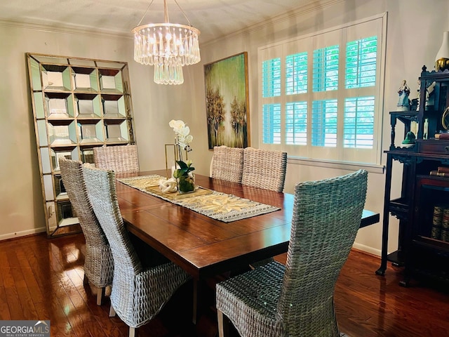 507 S College St, Metter, GA 30439 - dining area with a chandelier, wood-type flooring, baseboards, and crown molding