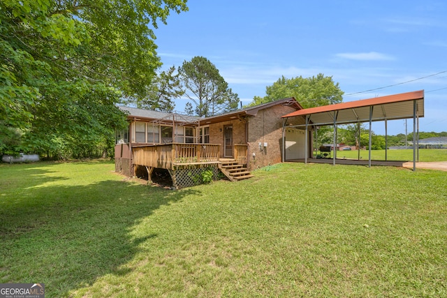676 Smith Store Rd, Covington, GA 30016 - rear view of house with a carport, a deck, brick siding, a yard, and driveway