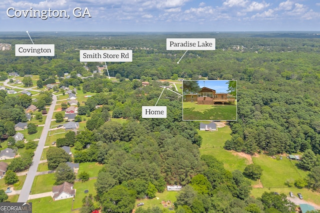 676 Smith Store Rd, Covington, GA 30016 - aerial view of property's location with a heavily wooded area and property boundaries highlighted