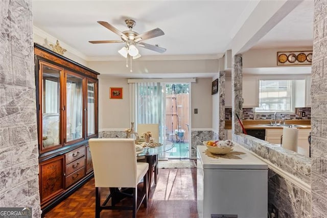8566 Jamestown Way, Jonesboro, GA 30238 - dining room featuring a ceiling fan and crown molding