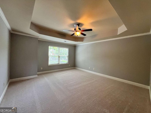 3522 Fallen Oak Dr, Buford, GA 30519 - spare room with a raised ceiling, ceiling fan, light carpet, ornamental molding, and baseboards