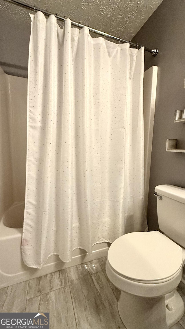 110 Waterloo Dr, Mount Airy, GA 30563 - full bath with shower / tub combo and a textured ceiling
