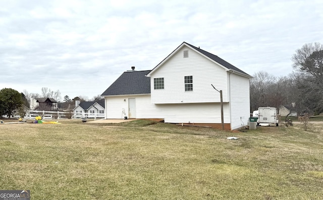 110 Waterloo Dr, Mount Airy, GA 30563 - back of property with a yard, roof with shingles, and a patio