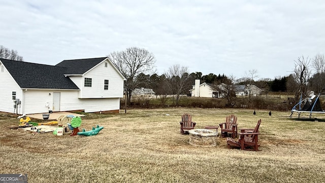 110 Waterloo Dr, Mount Airy, GA 30563 - view of grassy yard with a trampoline and a fire pit