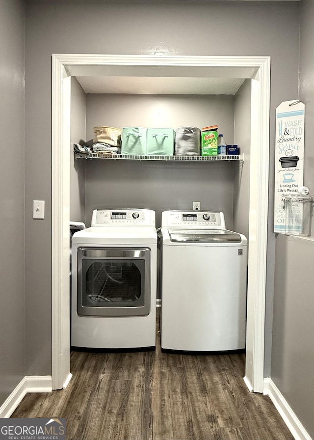 110 Waterloo Dr, Mount Airy, GA 30563 - laundry room with dark wood-type flooring and washer and clothes dryer