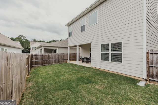 82 Castlemoor Loop, Adairsville, GA 30103 - back of property with a fenced backyard and a patio