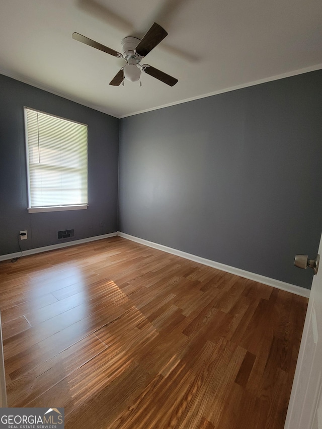 4157 Cedar Valley Ln, Conley, GA 30288 - unfurnished room with a ceiling fan, wood finished floors, crown molding, and baseboards