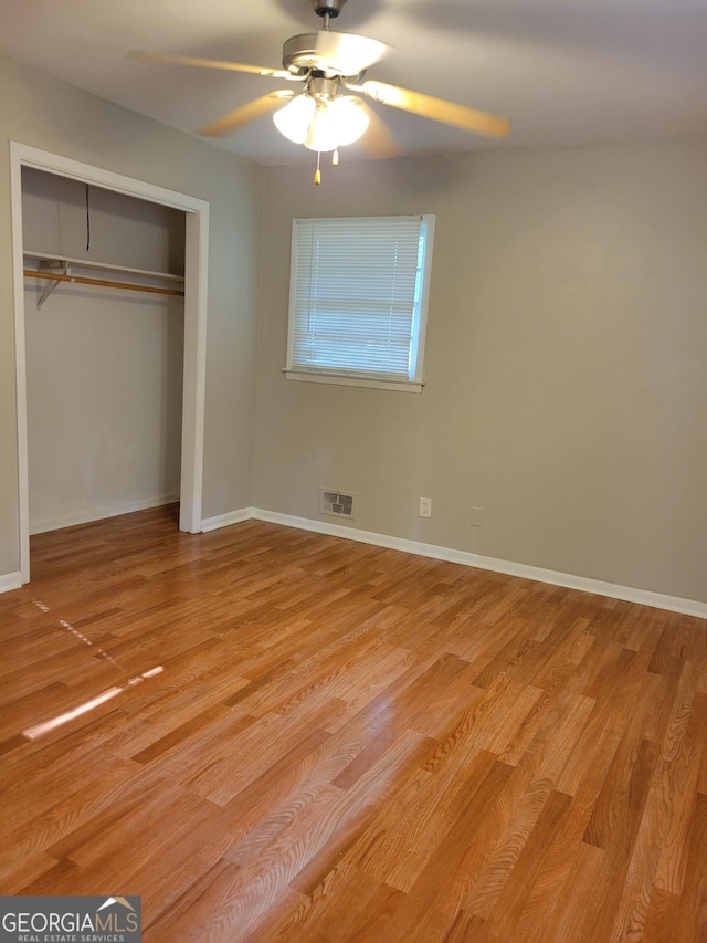 4157 Cedar Valley Ln, Conley, GA 30288 - unfurnished bedroom featuring light wood-style flooring, a closet, ceiling fan, and baseboards