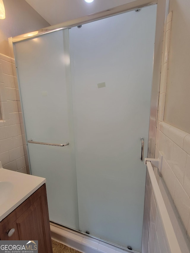 4157 Cedar Valley Ln, Conley, GA 30288 - full bath with tile walls, a stall shower, and vanity