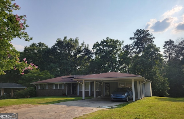 4157 Cedar Valley Ln, Conley, GA 30288 - single story home featuring concrete driveway, a front yard, and an attached carport