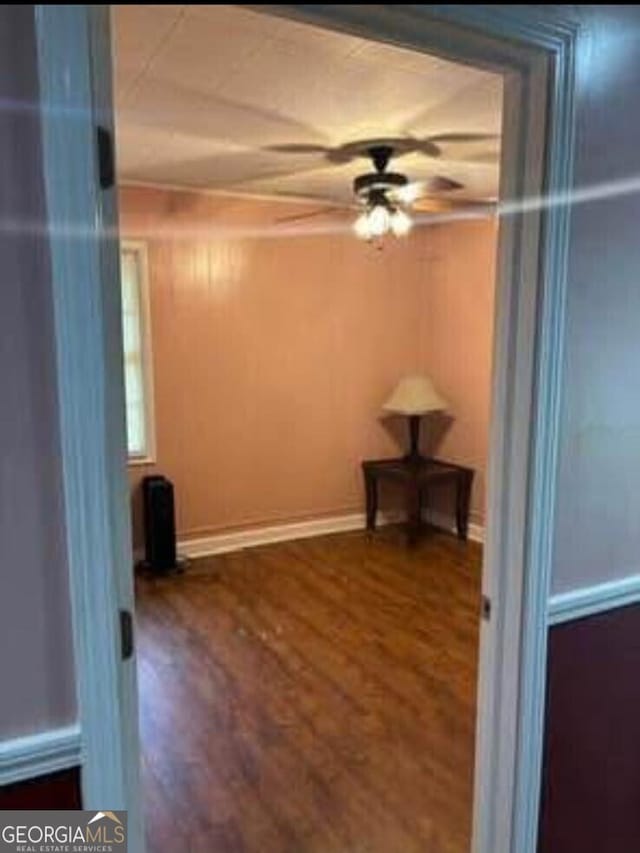 4157 Cedar Valley Ln, Conley, GA 30288 - empty room featuring a ceiling fan, wood finished floors, and baseboards