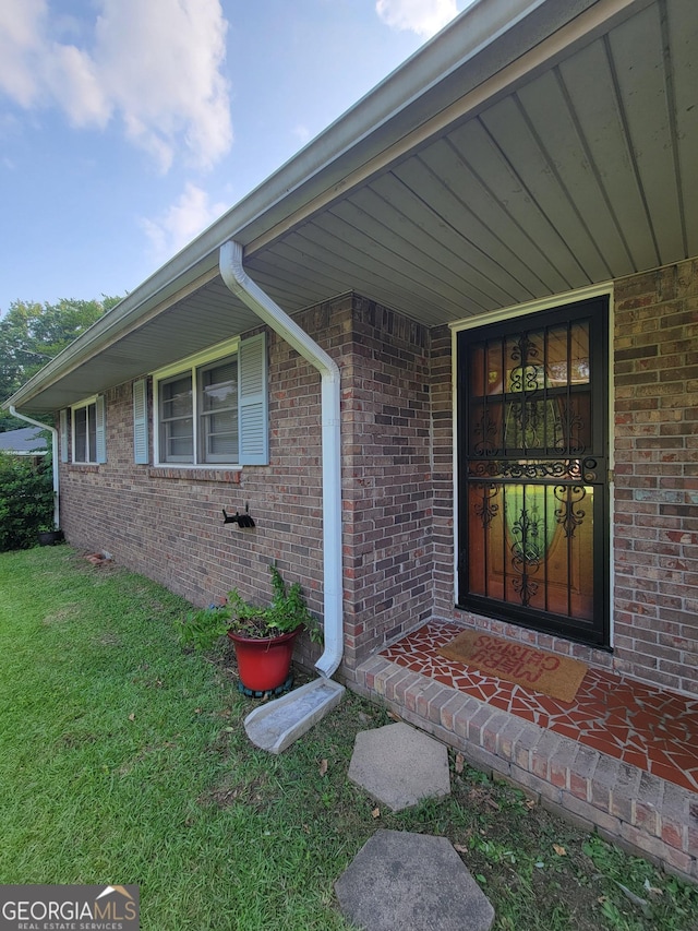 4157 Cedar Valley Ln, Conley, GA 30288 - doorway to property featuring a lawn