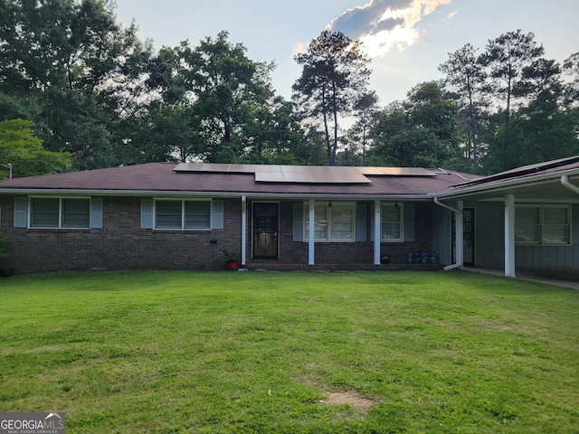 4157 Cedar Valley Ln, Conley, GA 30288 - ranch-style house with solar panels, a front lawn, and a porch